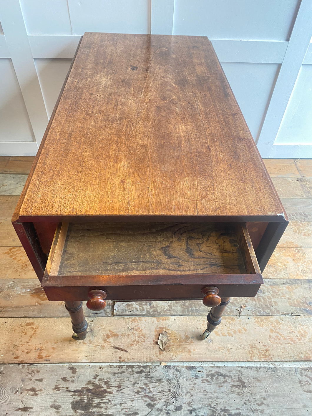 English mahogany Pembroke table on castors
