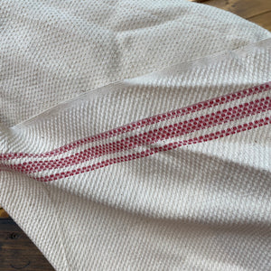 French roll of tea towel material red stripes