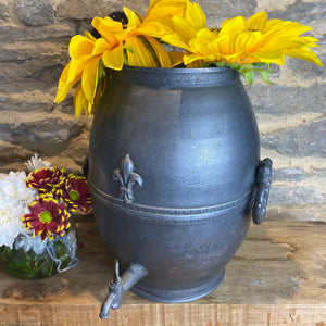 French pewter urn with decorative tap and fleur de lis design