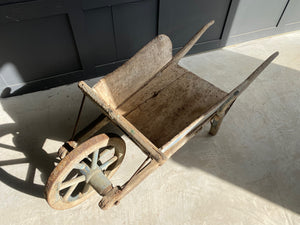 Washed out blue French wooden wheelbarrow